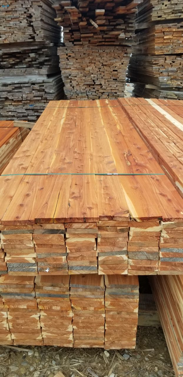 Bundles of cedar boards stacked in the Kentucky Wood Products lumber shed